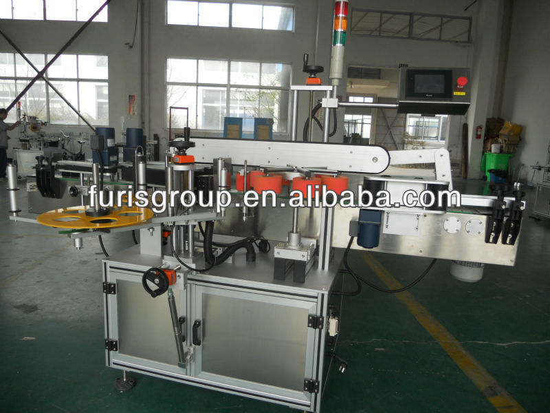 Adhesive sticker labeling machine for square bottle