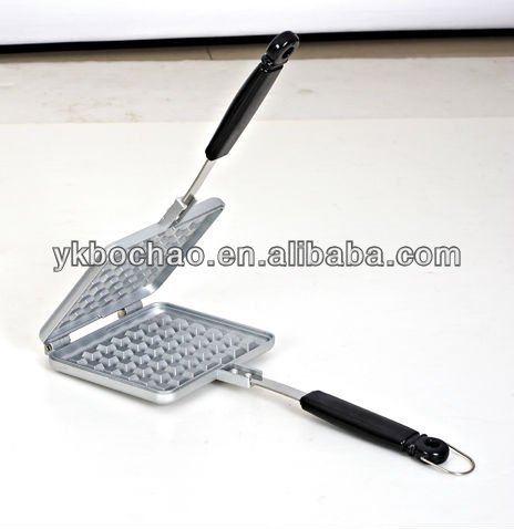 aluminum die cast non stick waffle iron maker on camp fire