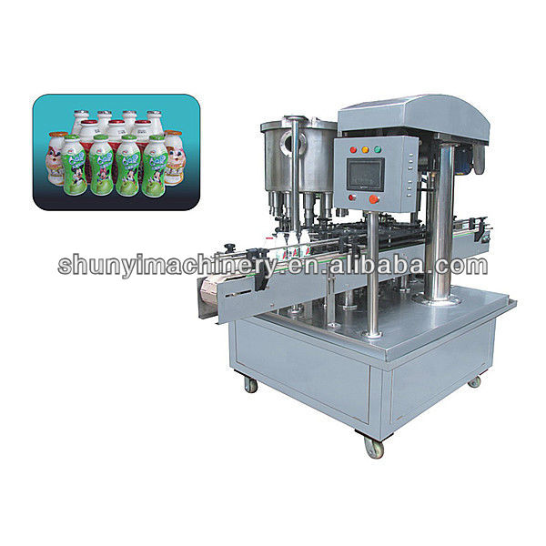 Auto bottle milk filling and seading machine