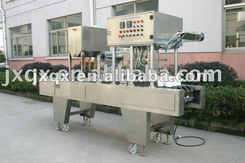 Automatic cylinder-packaged wet tissue wetting and cover conglutinating machine