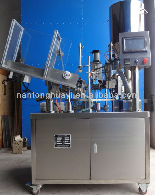 Automatic tube filling and sealing machine