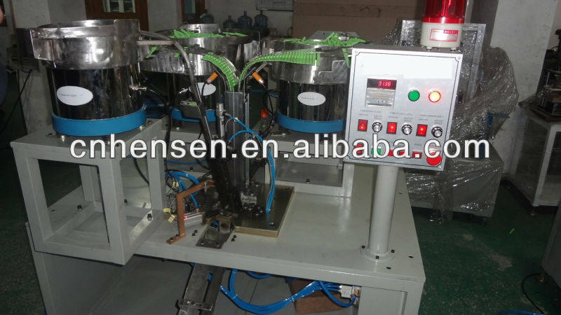 Cloth clamp assembly machine