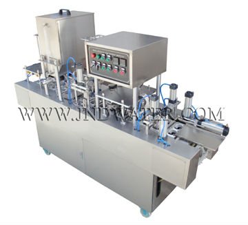 Cup filling and sealing machine