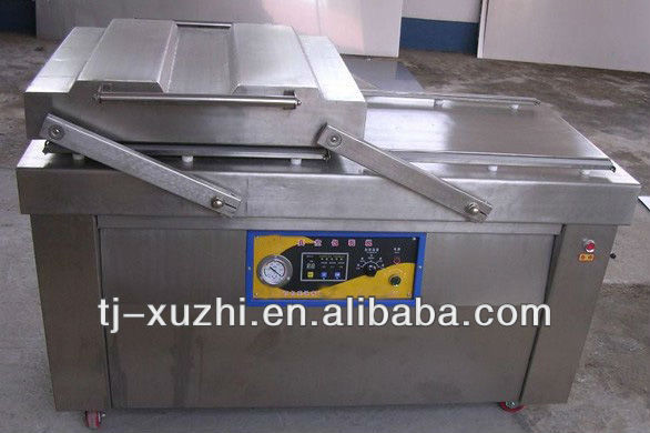 Dual chamber vacuum packing machine