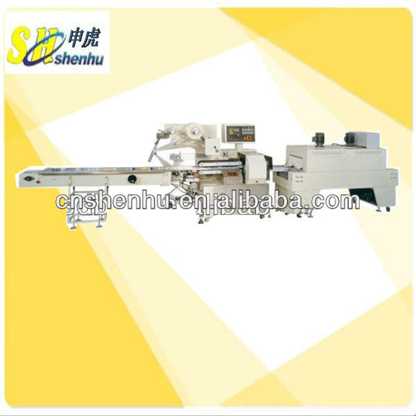 Horizontal type shrink wrapping machine