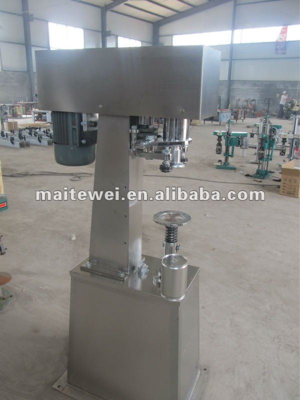 Nut can seaming machine