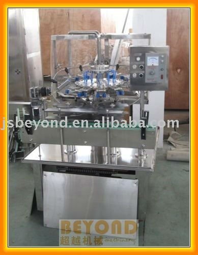 Rotary bottle rinser