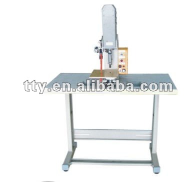 SNAP FASTENING MACHINE