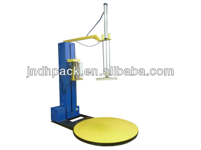 Top plate stretch pallet wrapping machine