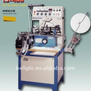 Garment label cutting machine