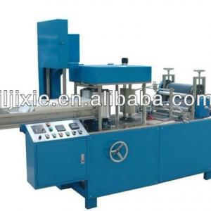 Nonwoven fabric embossing and folding machine