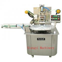 Rotary type cup sealing machine