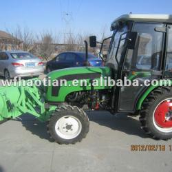 Snow blader fitted in front of the tractor