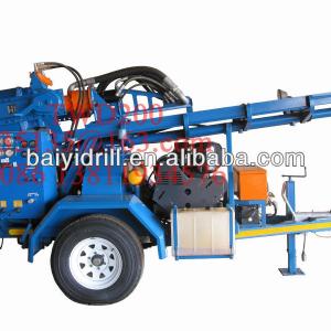 Trailer mounted water well drilling rig