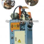 Chamfering machine for metal round pipes or bars