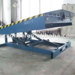 Stationary hydraulic dock leveler