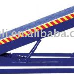 Stationary hydraulic dock leveler