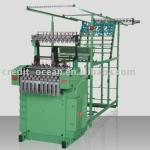 Zipper belt needle loom